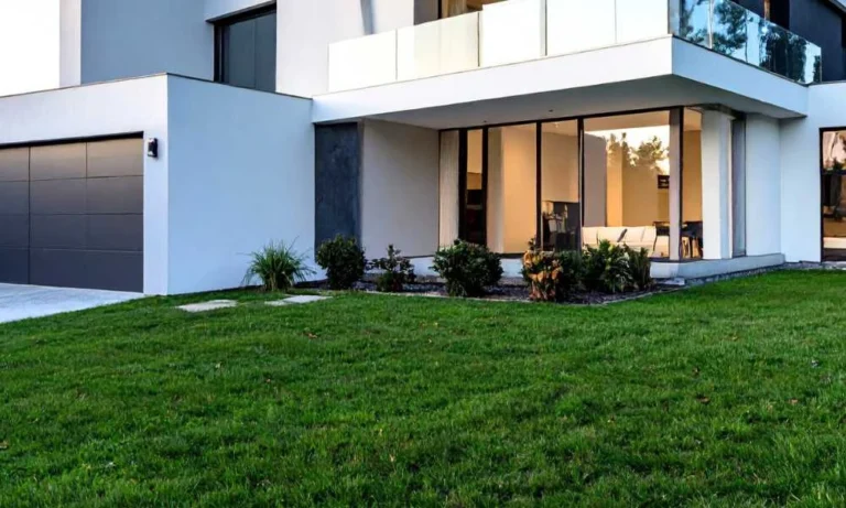 modern house exterior with green lawn