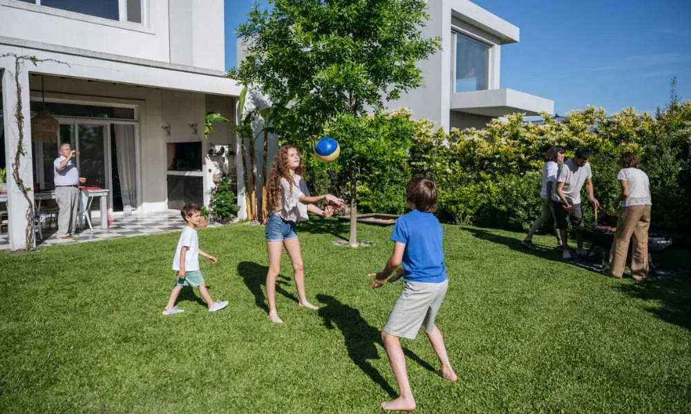 family playing in backyard