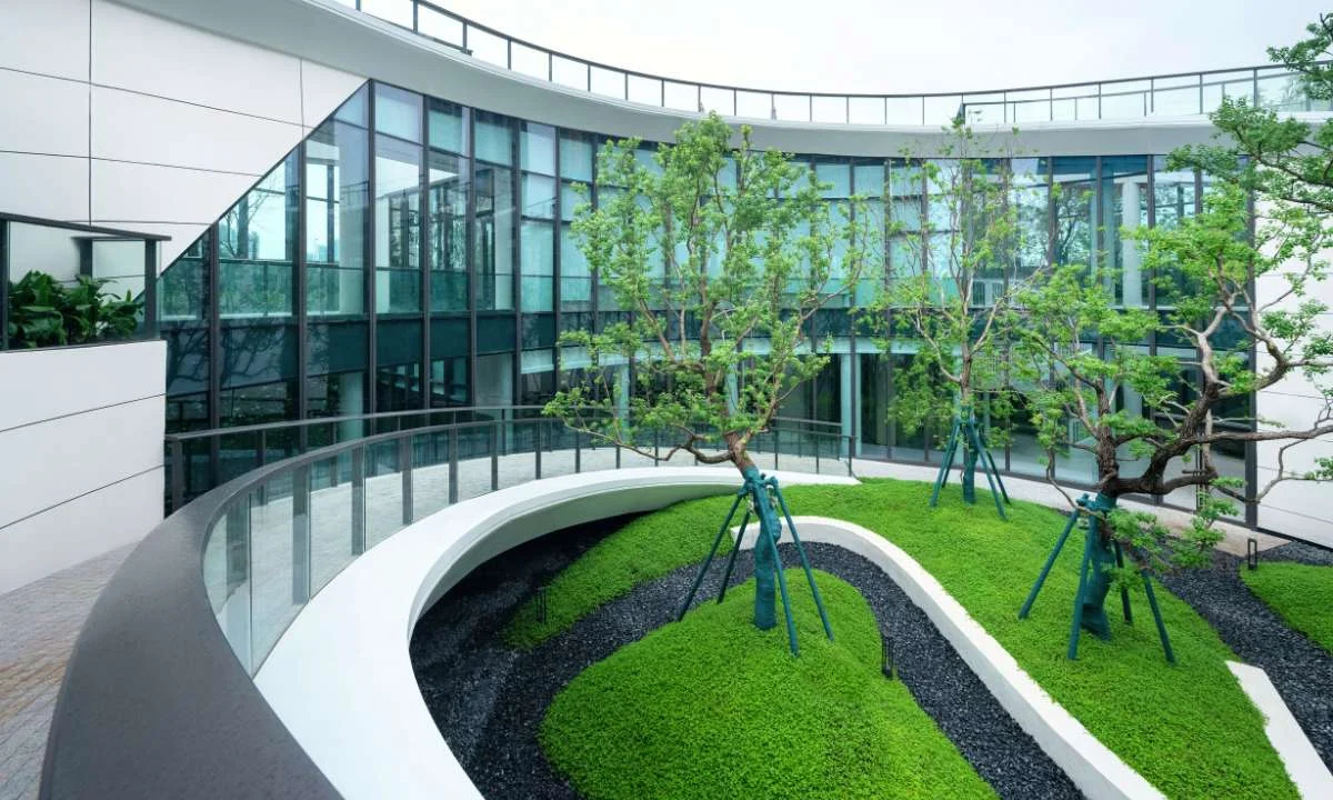 modern office building with a green courtyard