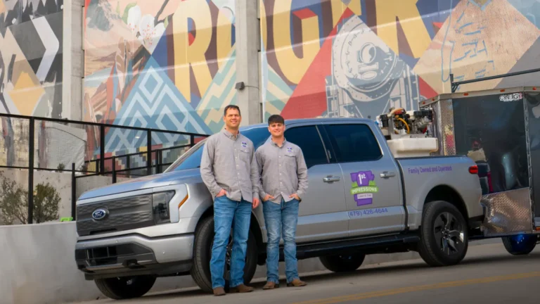1st Impressions owners and Truck in front of Rogers Graffiti
