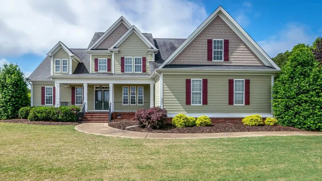 Residential lawn with thin, patchy grass and brown areas showing signs of neglected aeration